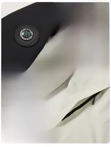 Detailed close-up of a waterproof jacket featuring windproof zippers and sleeve patch
