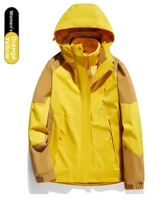 Close-up of women's orange and khaki outdoor jacket with waterproof zipper and velcro cuffs