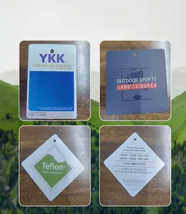 Detailed view of high-quality YKK zippers and Teflon fabric protection tags on outdoor jacket