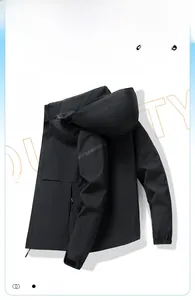 Detail view of black outdoor windproof hooded jacket with adjustable cuffs and sleeve logo