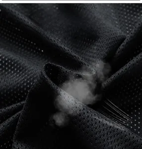 Macro shot of breathable mesh fabric showing moisture-wicking technology for jackets