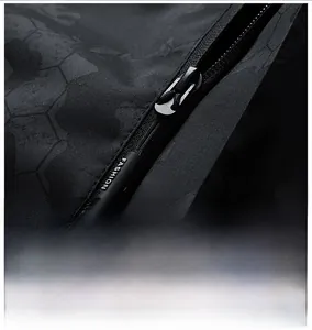 Close-up of black jacket zipper with honeycomb texture and fashion branded drawstring