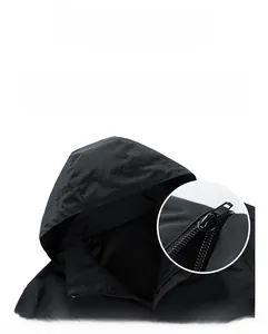Detail of men's windproof hooded jacket with adjustable drawstring and stand collar