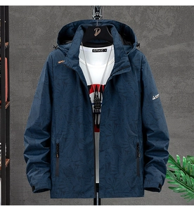 Detail of navy blue hooded jacket with floral leaf pattern and front zipper closure