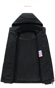 Detail view of breathable black mesh lining and inner storage pocket of the outdoor jacket