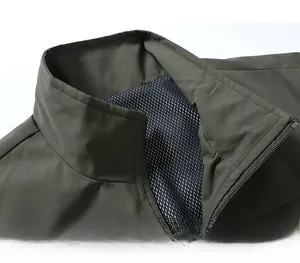 Detailed close-up of military green outdoor vest featuring stand collar and mesh lining