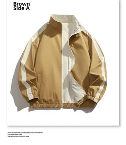 Gros plan de la veste réversible marron avec bandes d'épaules blanches et poignets élastiques