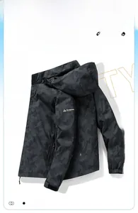 Detail of waterproof outdoor hooded jacket sleeve with adjustable velcro cuff and print