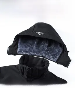 Detail view of a black outdoor jacket with a detachable fleece-lined hood and stand collar