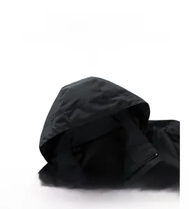 Close-up of black windbreaker hoodie showing zipper detail and breathable mesh lining