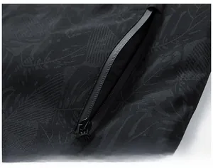 Macro shot of waterproof jacket fabric with leaf pattern and hidden zipper detail