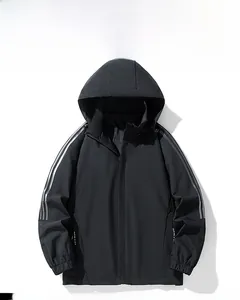 Detail of black hooded jacket featuring silver reflective stripes on the matte fabric sleeve