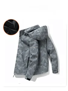 Detail of hooded outdoor jacket featuring breathable mesh lining and camo texture