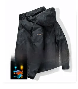 Close-up of windproof hooded jacket showing honeycomb camo texture and high-density weave