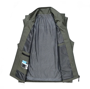 Detail of army green fishing vest featuring breathable mesh lining and inner zip pocket