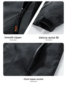 Detail of waterproof taped zipper and honeycomb texture fabric on black outdoor jacket