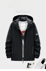 Detail of detachable hood and high-quality zipper on casual black men's jacket