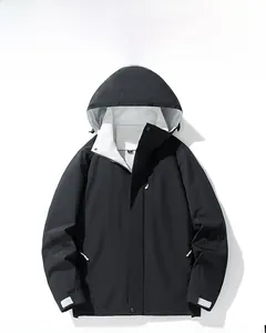 Detail of outdoor jacket with adjustable hood, velcro cuffs and water-resistant matte fabric