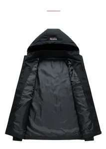 Detail view of the soft inner lining and interior pocket of this black hooded windbreaker