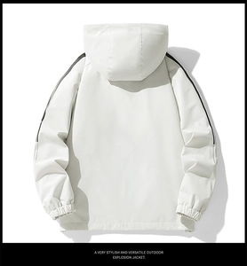 Back view of cream white outdoor jacket with black side stripes and elastic cuffs