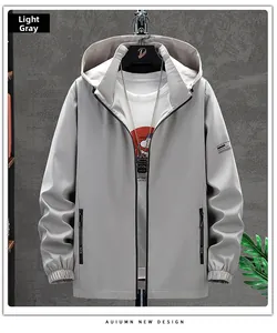 Detail view of a light grey hooded jacket with elastic cuffs and zipped side pockets