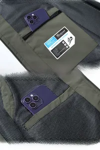 Detail of multi-pocket vest showing mesh lining and secure zipper interior pocket