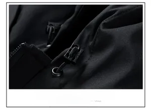 Close-up of adjustable elastic drawstring and toggle on a black windproof jacket hood