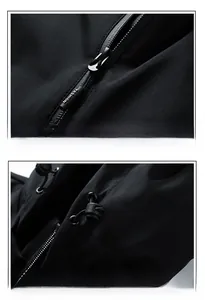 Detail of metal zipper with fashion engraving and adjustable drawstring on black jacket