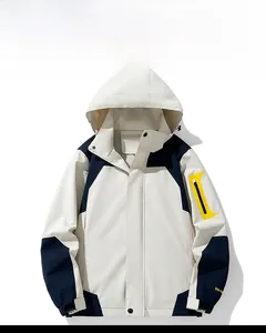 Detail of waterproof outdoor jacket featuring color-block design and adjustable velcro cuffs