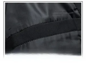 Detailed macro view of the sleek interior pocket and precision stitching on the black jacket