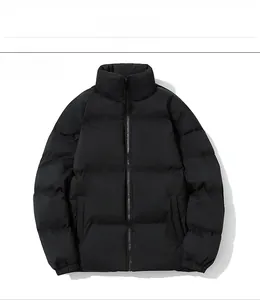 Detail view of winter black puffer jacket showing stand collar and quilted texture