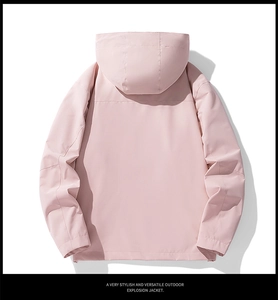 Rear view of pink waterproof outdoor jacket showing hooded design and windproof fabric