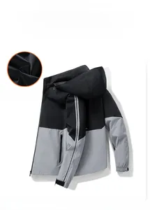 Detail of windproof outdoor jacket featuring breathable black mesh lining and velcro cuffs
