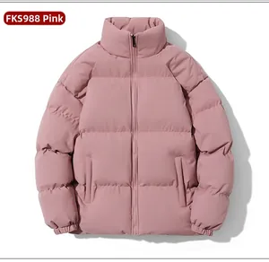 Detailed view of pink puffer jacket with quilted texture and high stand-up collar