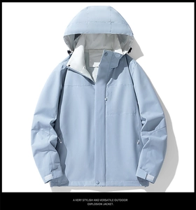 Detail of light blue waterproof jacket with windproof hood and breathable mesh lining
