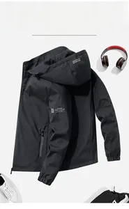 Detail of black hooded jacket with zipper pockets and AQUARCH logo printing
