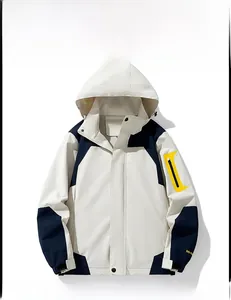 Detail of outdoor jacket showing contrast colors, adjustable hood and arm pocket