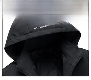Detail view of the windproof hood and neckline with AQUATECH logo on a black men jacket