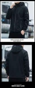 Detail of men's black hooded windbreaker featuring zip pockets and waterproof cuffs