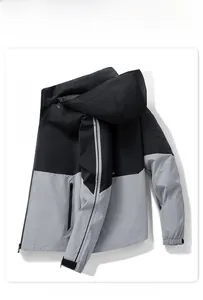 Detail view of water-resistant hooded jacket with velcro cuffs and zipper pockets