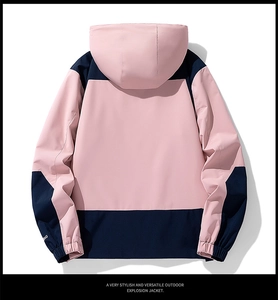 Rear view of a windproof outdoor jacket featuring pink and navy contrast stitching design