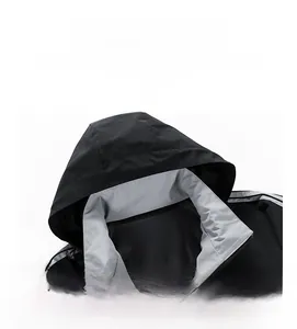 Detail of hooded jacket with breathable grey mesh lining and windproof fabric