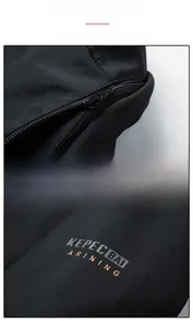 Detail of the detachable hood zipper and Kepecbai training print on the jacket arm