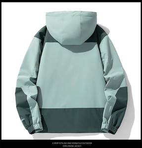 Back view of green hooded jacket showing waterproof windproof elastic cuffs and color blocks