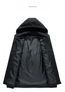 Detail view of the smooth polyester lining and interior chest pocket of black hooded jacket