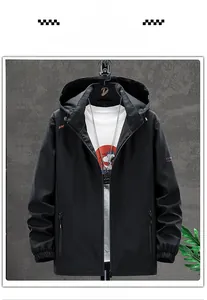 Detail view of men's black hooded jacket with zipper pockets and ribbed cuffs