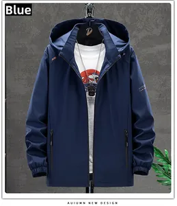 Detail view of a navy blue windbreaker jacket with orange logo and elastic cuffs