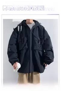 Detail of hooded techwear jacket featuring multi-pocket design and buckle strap details