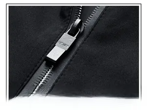 Detail of premium black metal zipper with Fashion engraving on casual winter jacket