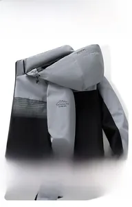 Detail of waterproof breathable fabric on light gray men's hooded jacket sleeve